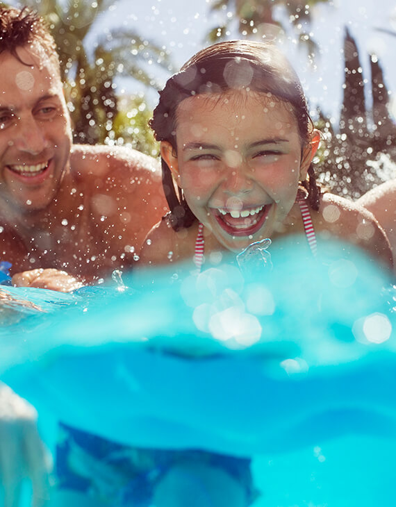 father and daughter in the pool