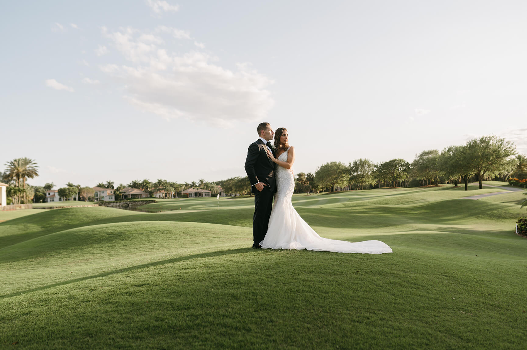 bride and groom on golf course